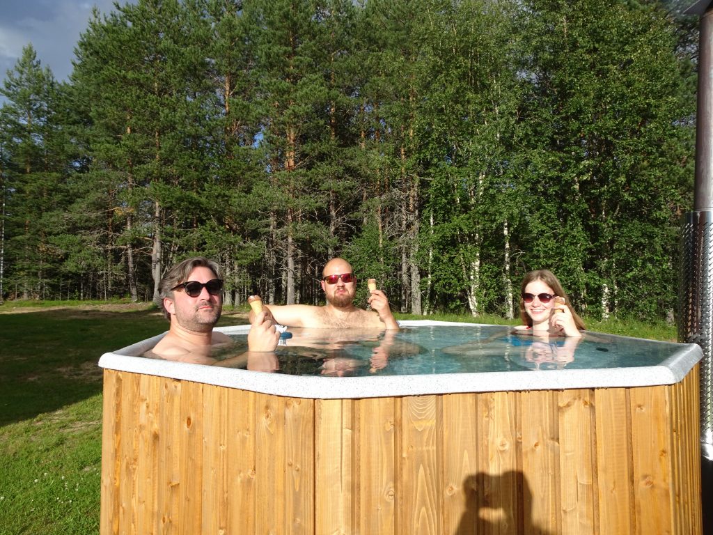 three persons in a hottub